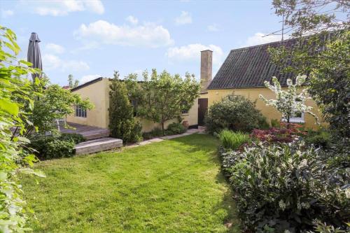 an exterior view of a house with a yard at FY252-Haarby-Brunshusevej-23 in Hårby