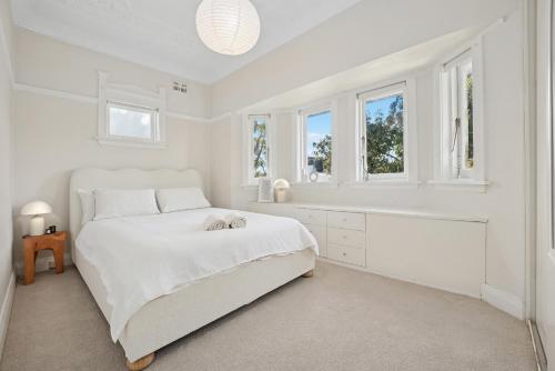 En eller flere senge i et værelse på Bondi Casa