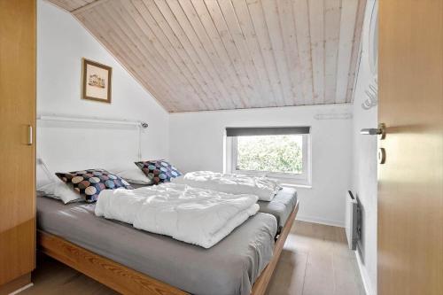 a bedroom with two beds and a window at FY131-Middelfart-Stjernevej-111 in Middelfart