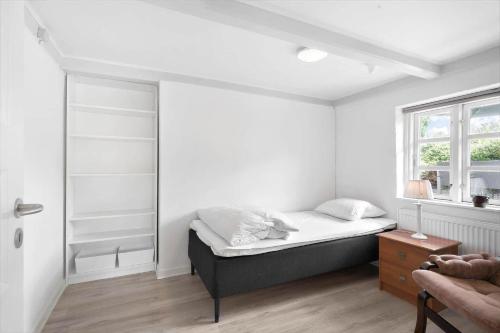 a bedroom with a bed and a window at FY344-Dalby-Fynshovedvej-344 in Dalby