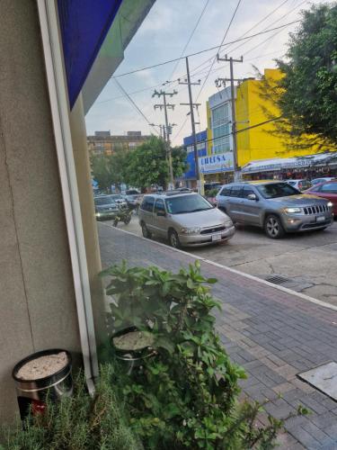a view of a street with cars parked on the road at Hotel Coatza Inn in Coatzacoalcos