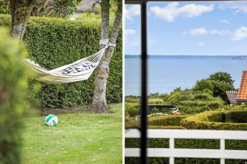 two pictures of a hammock in a yard with the ocean at FY100-Asperup-Bogevangsvej-4 in Asperup