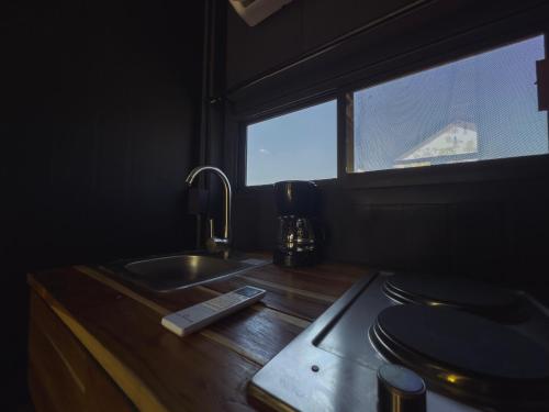 a kitchen with a sink and a window at Amazing cabin in Samalayuca in Samalayuca