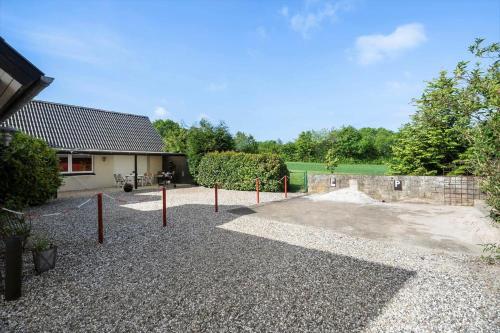 a parking lot with a skate park in front of a house at FY278-Tommerup-Tobovej-80 in Tommerup