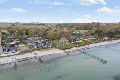 an aerial view of a beach with houses and the water at FY377-Nyborg-Svalevej-6 in Nyborg