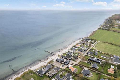 an aerial view of a beach with houses and the ocean at FY377-Nyborg-Svalevej-6 in Nyborg