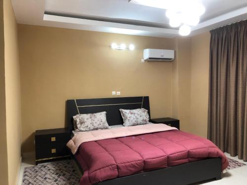 Postel nebo postele na pokoji v ubytování Karmelia