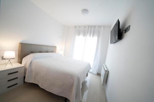 Postel nebo postele na pokoji v ubytování Kisa Apartments de Manresa