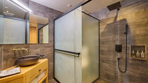 a bathroom with a sink and a shower at Kumonoue Fuji Hotel Standard room - Mt Fuji view with open-air bath in Fujikawaguchiko