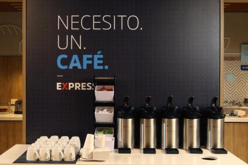 a group of bottles of wine sitting on a table at Holiday Inn Express Torreon by IHG in Torreón
