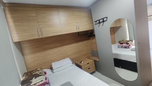 Ένα ή περισσότερα κρεβάτια σε δωμάτιο στο Studio Aconchego
