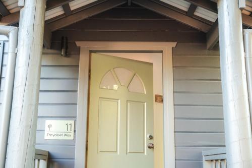 a front door of a house with columns at Melo Beach Escape - Luxury Gnarabup beach house in Gnarabup