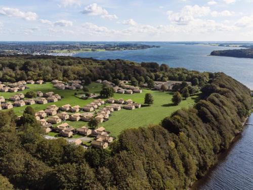 an aerial view of a village on a island in the water at Middelfart Holiday Center in Middelfart