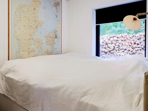 Una cama o camas en una habitación de Seaside Serenity in Jaegerspris-By Traum