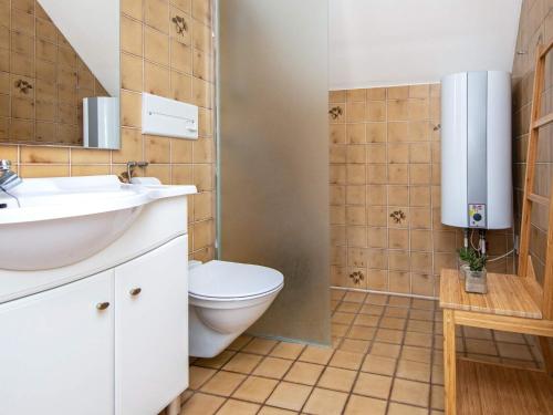 a bathroom with a toilet and a sink at 5 person holiday home in Rømø-By Traum in Sønderby