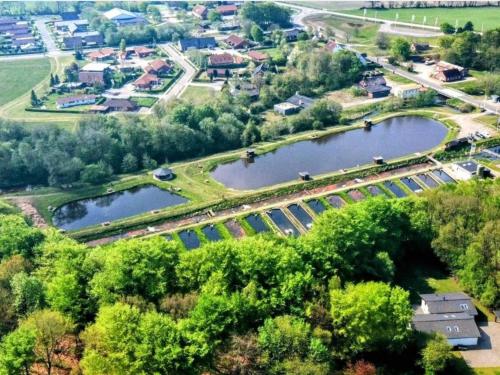 an overhead view of a park with two lakes at 4 person holiday home in Hovborg-By Traum in Hovborg