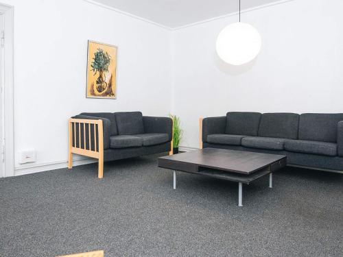 a living room with two couches and a coffee table at Charming Retreat by Fjord - By Traum Ferienwohnungen in Ringkøbing