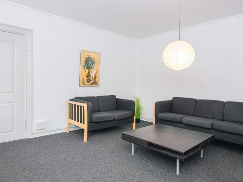 a living room with two couches and a coffee table at Charming Retreat by Fjord - By Traum Ferienwohnungen in Ringkøbing
