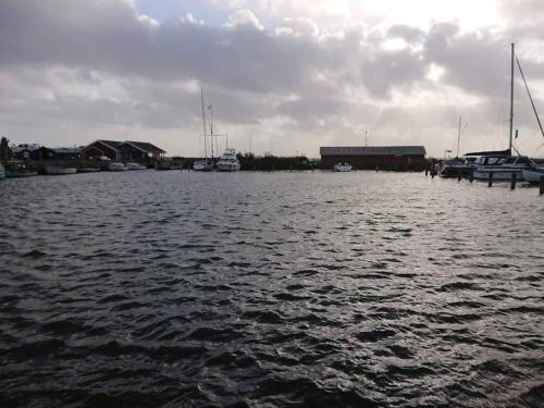 a large body of water with boats in it at Charming Retreat by Fjord - By Traum Ferienwohnungen in Ringkøbing