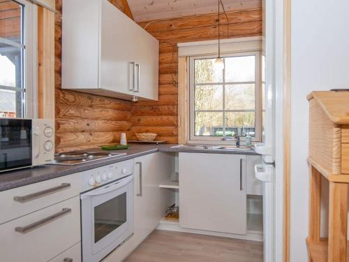 a kitchen with white appliances and a window at 4 person holiday home in Hovborg-By Traum in Hovborg