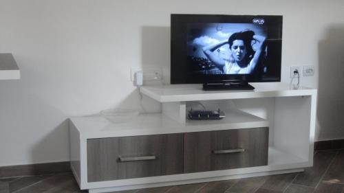a flat screen tv on a white entertainment center at Apartmani Jankovic in Budva