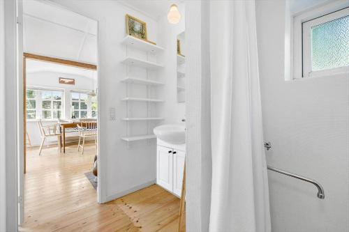 a bathroom with a shower and a sink in a room at 6667-Allinge-Solvej-1-B in Allinge