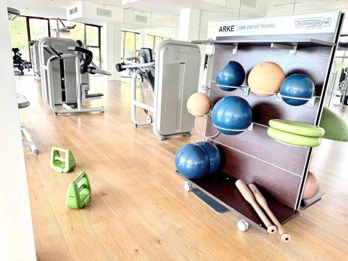 a gym with balls and exercise equipment on the floor at Bolongo 3BR your exclusive oceanfront escape in Punta Mita
