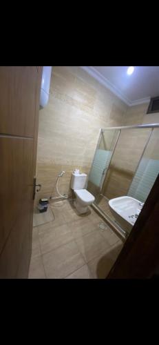 a bathroom with a toilet and a sink at sahari-2 in Amman
