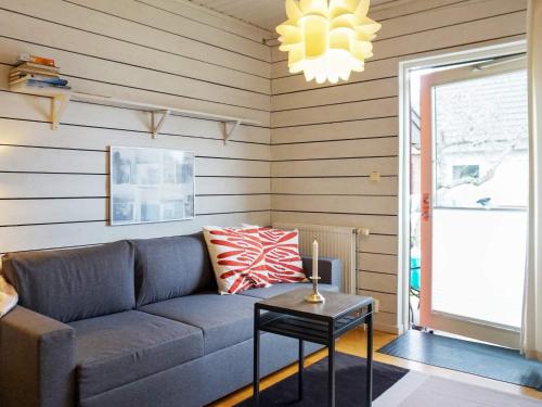 a living room with a couch and a table at Apartment in center of Strömstad in Strömstad