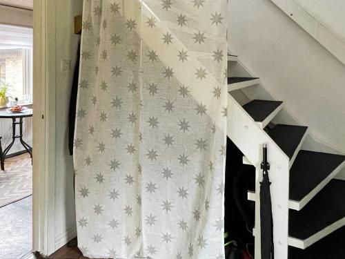 a stair case with a curtain with stars on it at 5 person holiday home in LÖDDEKÖPINGE in Löddeköpinge