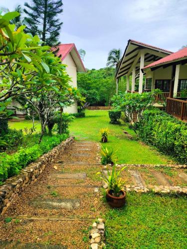 a garden in front of a house at Asia Grand View Hotel in Coron