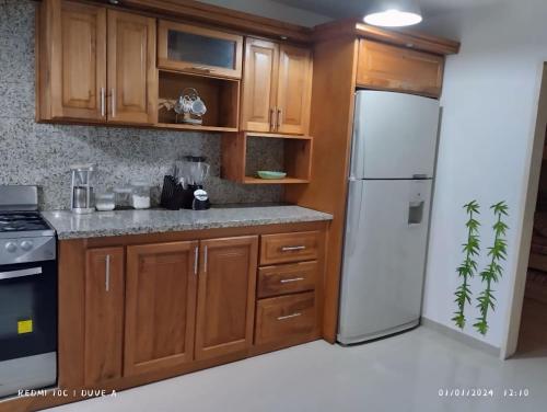 Kuchyň nebo kuchyňský kout v ubytování Apartamento Playa Familiar Ciudad Flamingo Tucacas Chichiriviche