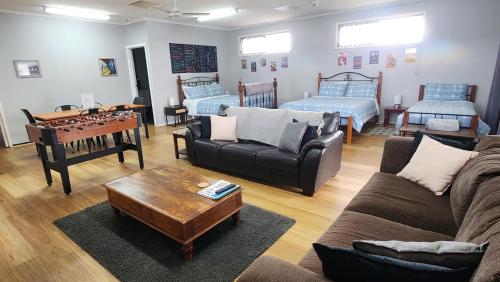 a living room with a couch and a table at The Corner Store B&B in Stawell