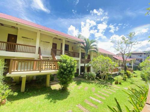 a resort with a large yard and a building at Asia Grand View Hotel in Coron