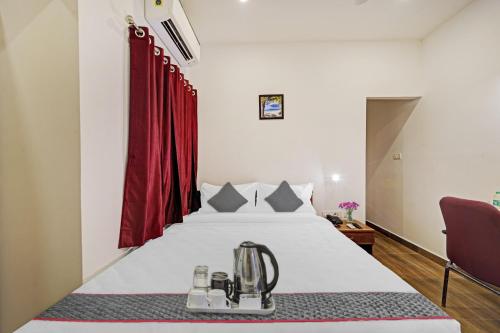 Ένα ή περισσότερα κρεβάτια σε δωμάτιο στο Townhouse ORCHID RESIDENCY Near T.Nagar