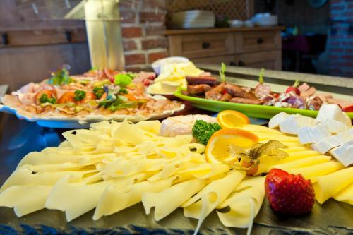 a buffet of food with pasta and fruit on a table at Winklmoos Sonnenalm in Reit im Winkl