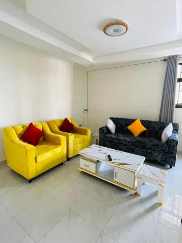 Posezení v ubytování Iwabo Apartments Kigali Airport Kanombe