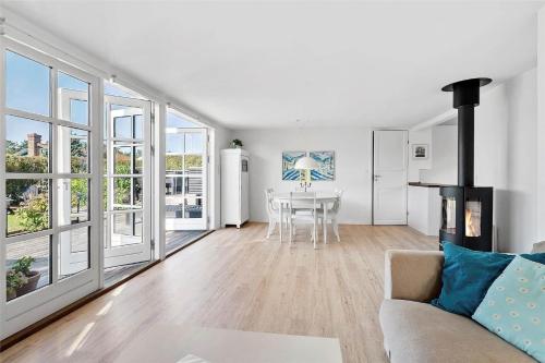 a living room with a couch and a table at FY318-Nyborg-Sommerbyen-23 in Nyborg