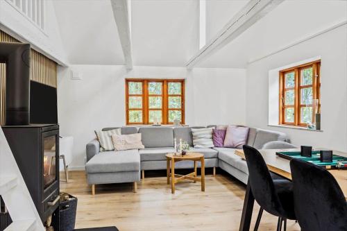 a living room with a couch and a table at LF11124-Struer-Vesterkaervej-24 in Struer