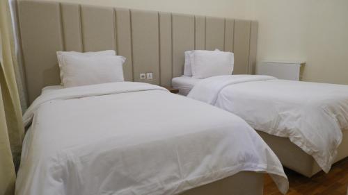 Katil atau katil-katil dalam bilik di Diyar Villas Puncak NB3/3