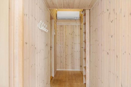 a hallway of a room with white walls and wooden floors at LF14194-Roslev-Bagvejen-26 in Roslev