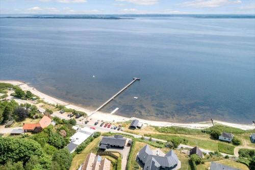 an aerial view of a beach with a large body of water at LF14194-Roslev-Bagvejen-26 in Roslev