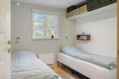 a bedroom with two beds and a window at LF11731-Struer-Skraningen-31 in Struer