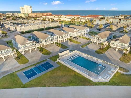 an aerial view of a resort with a swimming pool at Cozy Villa Walk to Beach in Galveston