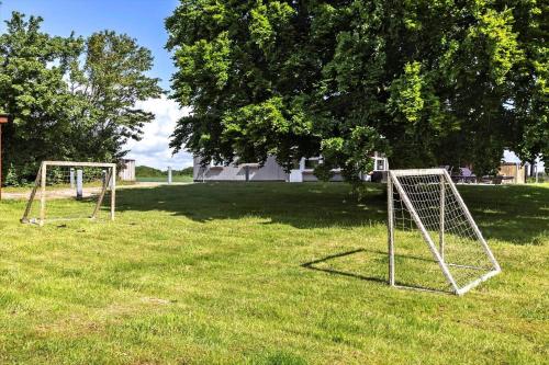two goal nets in a field with a tree at LF14145-Spottrup-Uglkaeret-5 in Spottrup