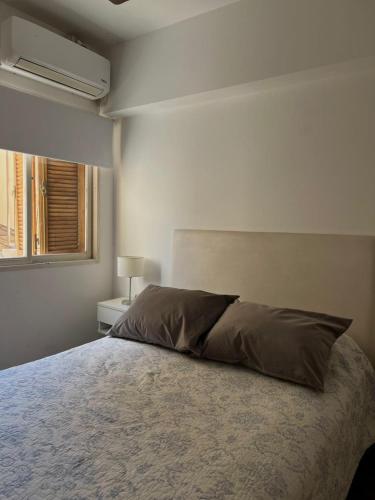 Ένα ή περισσότερα κρεβάτια σε δωμάτιο στο Departamento céntrico