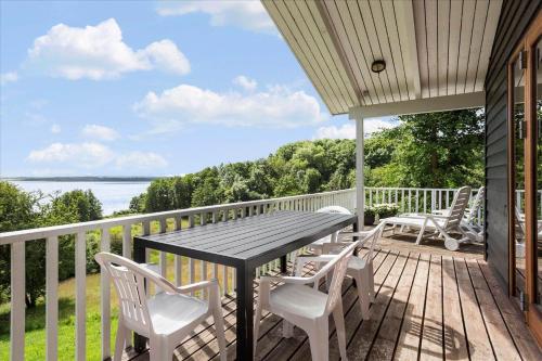 a patio with a table and chairs on a deck at LF483-Snedsted-Bjergvej-8 in Snedsted