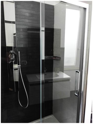 a bathroom with a shower and a sink at Corte del Pascià in Lecce