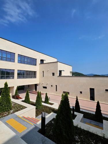 a large building with trees in front of it at Goseong-gun Youth Hostel 