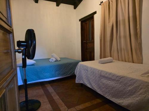 Ένα ή περισσότερα κρεβάτια σε δωμάτιο στο Charming Colonial Villa Azotea